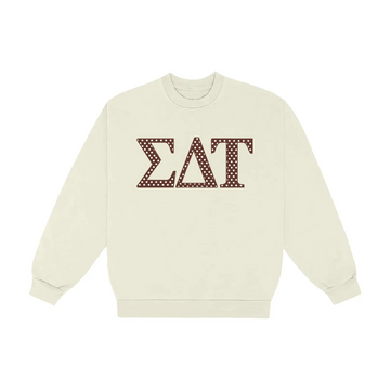 Cream crewneck with ΣΔΤ (Sigma Delta Tau) in brown polka-dot Greek letters on the chest.