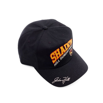 Black Shadow Hill Sunday Rally cap with red and yellow embroidery and a white signature on the brim