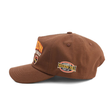 Brown Shadow Hill Sunday Rally cap with red and yellow embroidery and a white signature on the brim